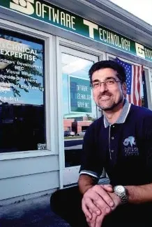 Photo of Jay Abramovitz squatting in front of STG's front door