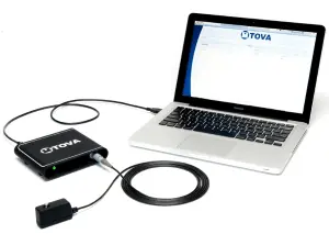 Photo of a TOVA device attached to a laptop